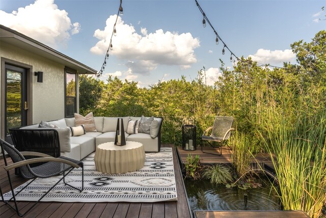 wooden deck featuring outdoor lounge area