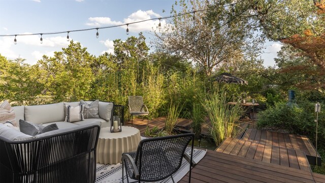 wooden terrace featuring an outdoor hangout area