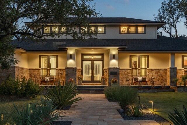 view of front of home featuring french doors and a porch