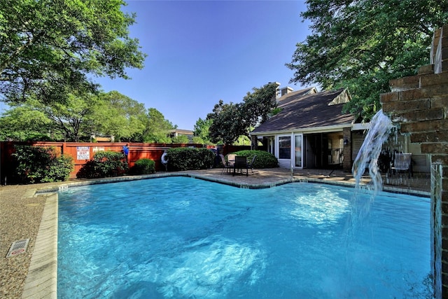 view of swimming pool featuring a patio area