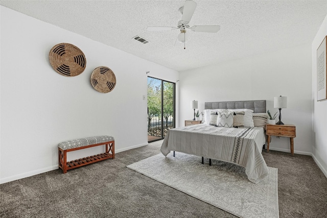 carpeted bedroom featuring access to outside, a textured ceiling, and ceiling fan