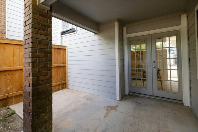 property entrance with french doors and a patio