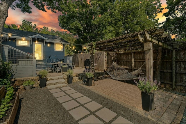 view of patio / terrace featuring fence and a pergola