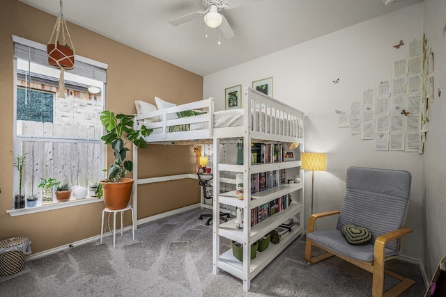 bedroom featuring ceiling fan, carpet flooring, and multiple windows