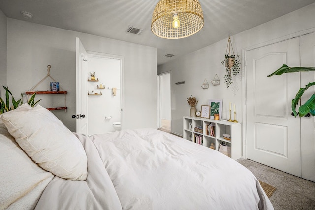 carpeted bedroom featuring a closet