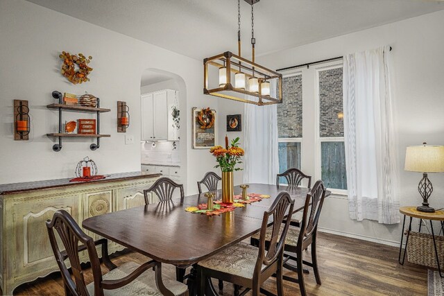 dining space with dark hardwood / wood-style floors