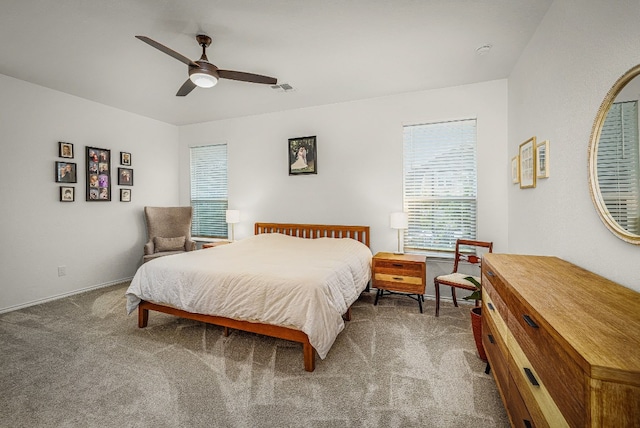 bedroom with ceiling fan and carpet