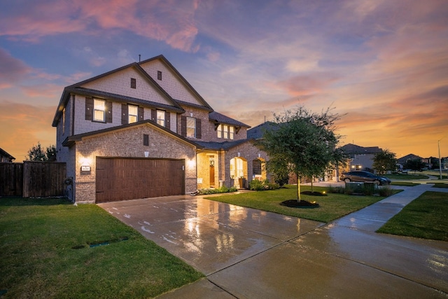 view of front facade featuring a garage and a lawn