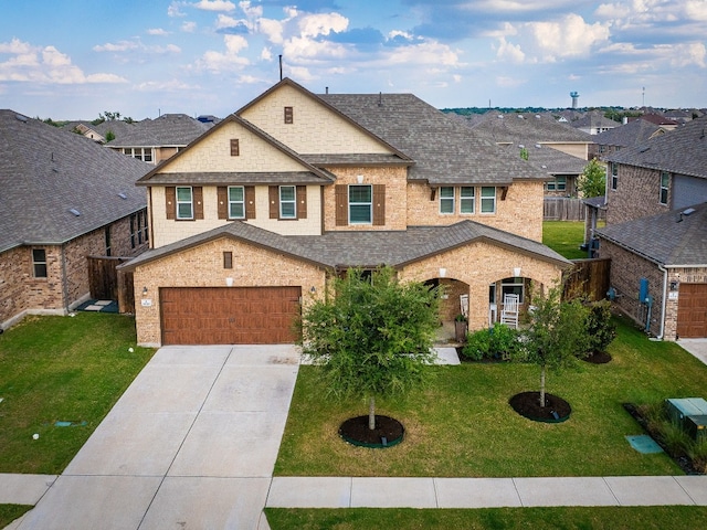 view of front of home with a garage and a front yard