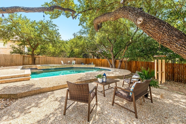 view of swimming pool featuring a patio area