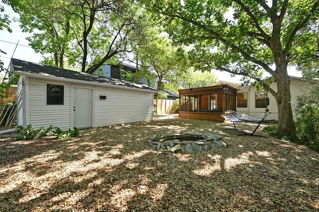 view of yard with an outdoor fire pit and a wooden deck