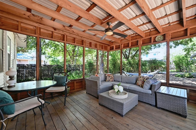 sunroom / solarium featuring ceiling fan