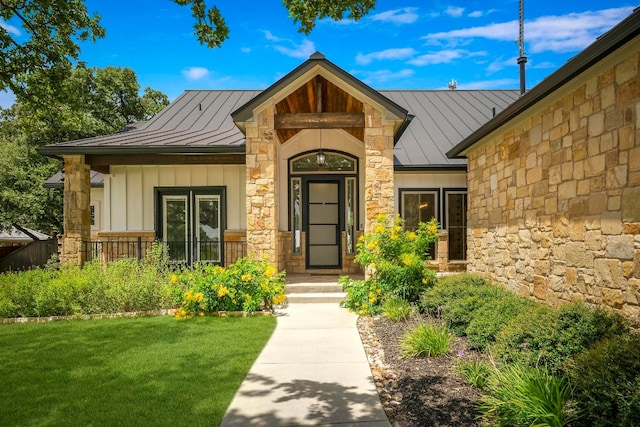 entrance to property with a yard