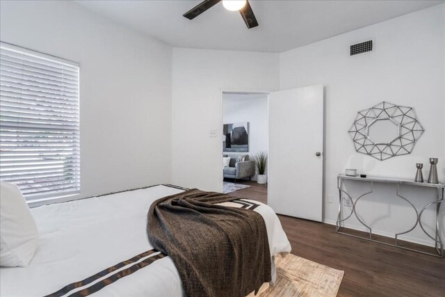 bedroom with ceiling fan and dark hardwood / wood-style floors