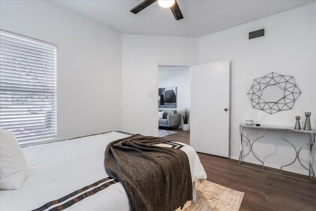 bedroom featuring dark hardwood / wood-style flooring and ceiling fan