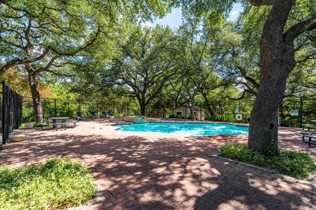 view of swimming pool featuring a patio area