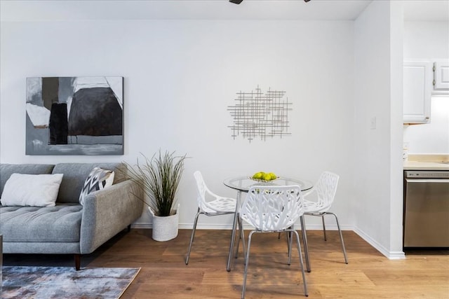 dining room featuring ceiling fan and hardwood / wood-style flooring