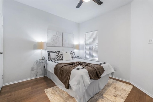 bedroom featuring dark hardwood / wood-style flooring and ceiling fan