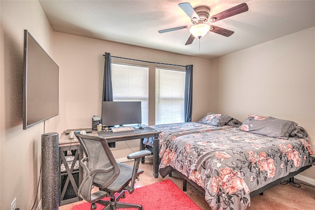 bedroom featuring light carpet and ceiling fan