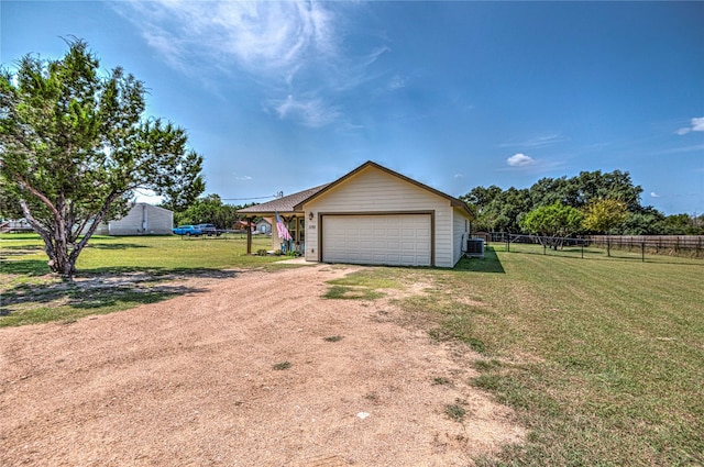 garage featuring a lawn