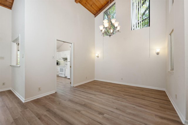 interior space featuring wood ceiling, light hardwood / wood-style floors, and high vaulted ceiling