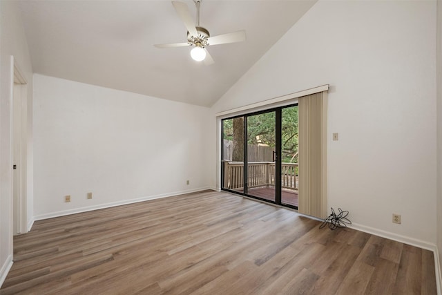 unfurnished room featuring high vaulted ceiling, wood finished floors, a ceiling fan, and baseboards