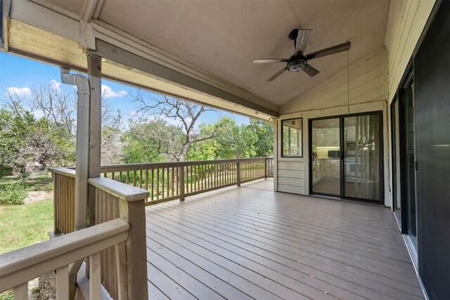 wooden deck featuring ceiling fan