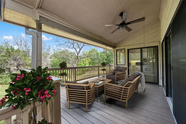 wooden terrace featuring ceiling fan and an outdoor hangout area