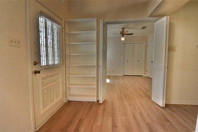 foyer entrance featuring ceiling fan and light hardwood / wood-style flooring