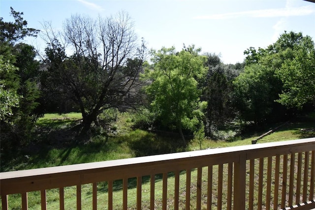 wooden terrace with a yard