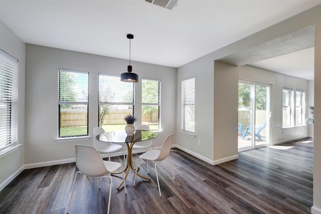 dining room with dark hardwood / wood-style floors