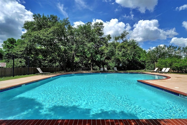 1109 Minerva St, Austin, TX 78753 - community pool featuring fence and view of wooded area