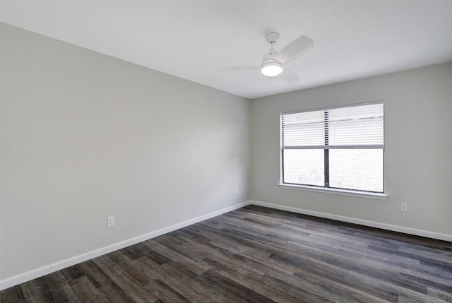 unfurnished room with dark hardwood / wood-style flooring and ceiling fan