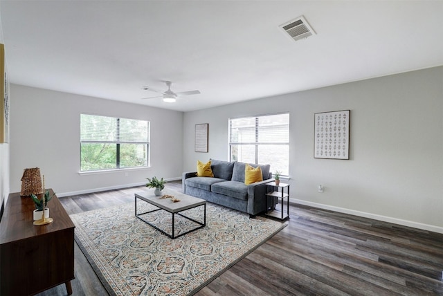 1109 Minerva St, Austin, TX 78753 - living room featuring plenty of natural light, dark wood-style flooring, ceiling fan, and baseboards
