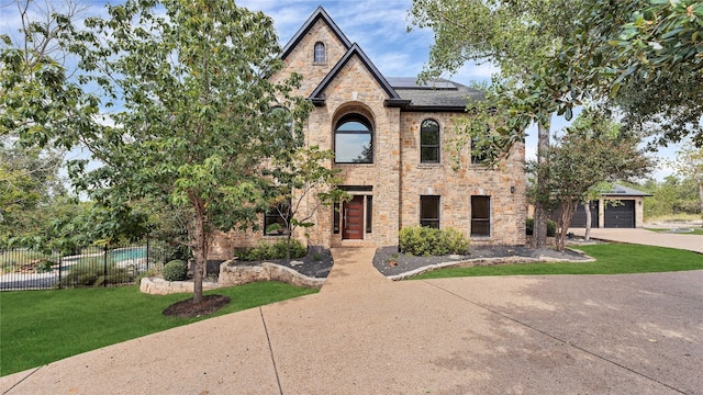 view of front facade featuring a front yard and a garage