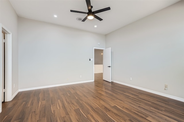 unfurnished bedroom featuring a high ceiling, ceiling fan, and dark wood-type flooring