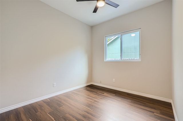 unfurnished room featuring dark hardwood / wood-style flooring and ceiling fan