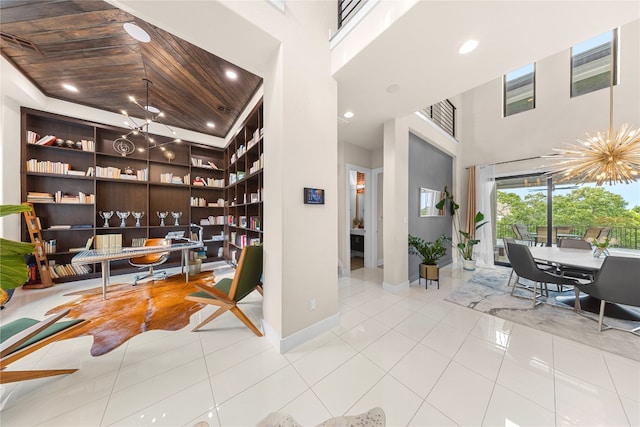 tiled office featuring wooden ceiling, a high ceiling, and a notable chandelier