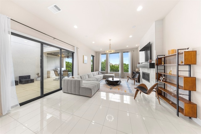 tiled living room featuring a premium fireplace