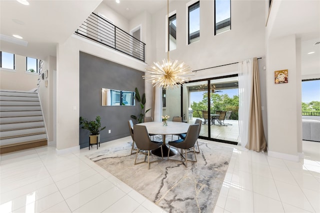 dining space with light tile patterned floors and a healthy amount of sunlight