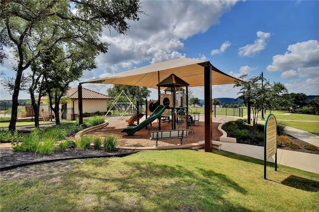 view of play area featuring a lawn