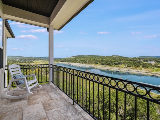 balcony featuring a water view