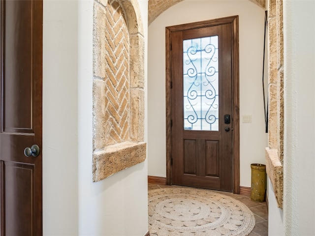 tiled foyer featuring plenty of natural light