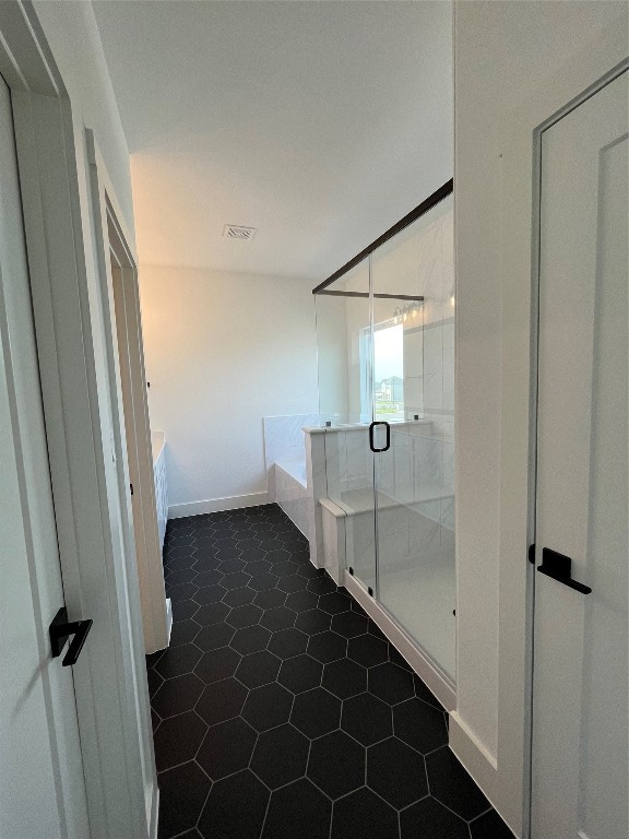 bathroom featuring shower with separate bathtub and tile patterned floors