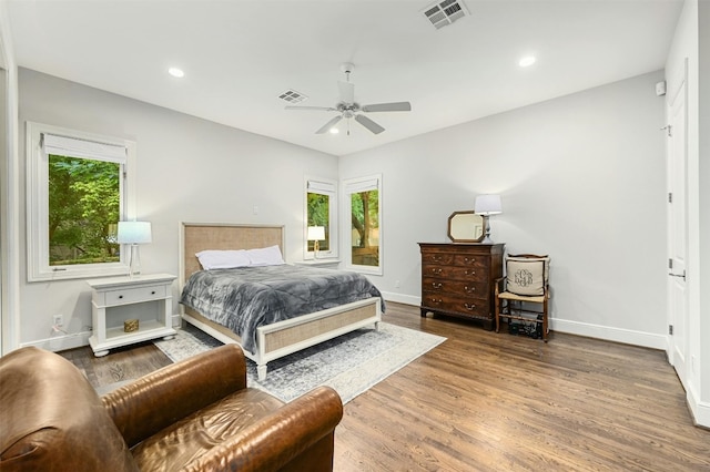 bedroom featuring ceiling fan and dark wood-type flooring