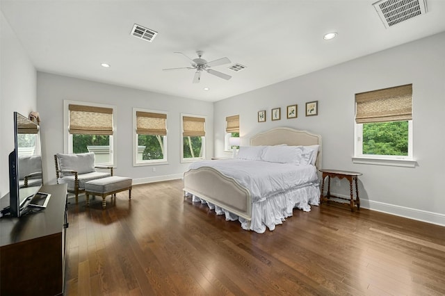 bedroom with hardwood / wood-style floors and visible vents