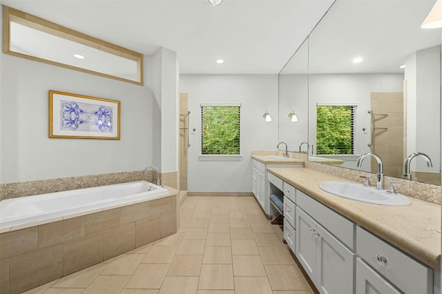 14 Margranita Cres, Austin, TX 78703 - bathroom featuring double vanity, a garden tub, a tile shower, tile patterned floors, and recessed lighting