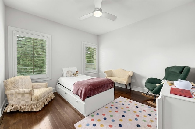 bedroom with dark wood-type flooring and ceiling fan