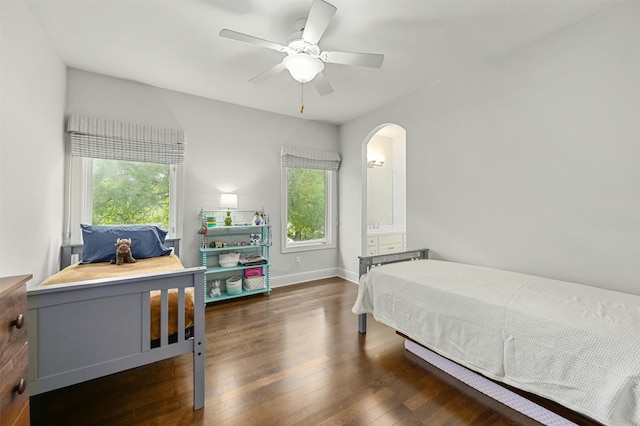 bedroom featuring multiple windows, ceiling fan, and dark wood-type flooring