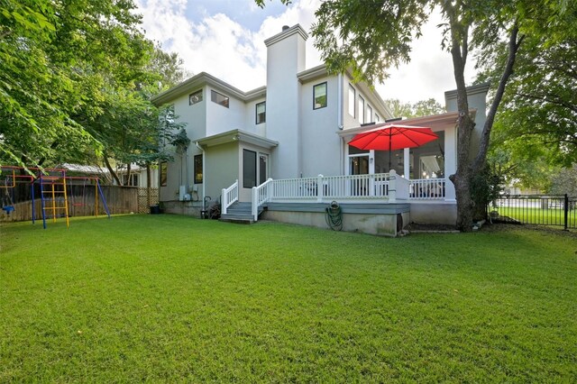 back of house with a lawn